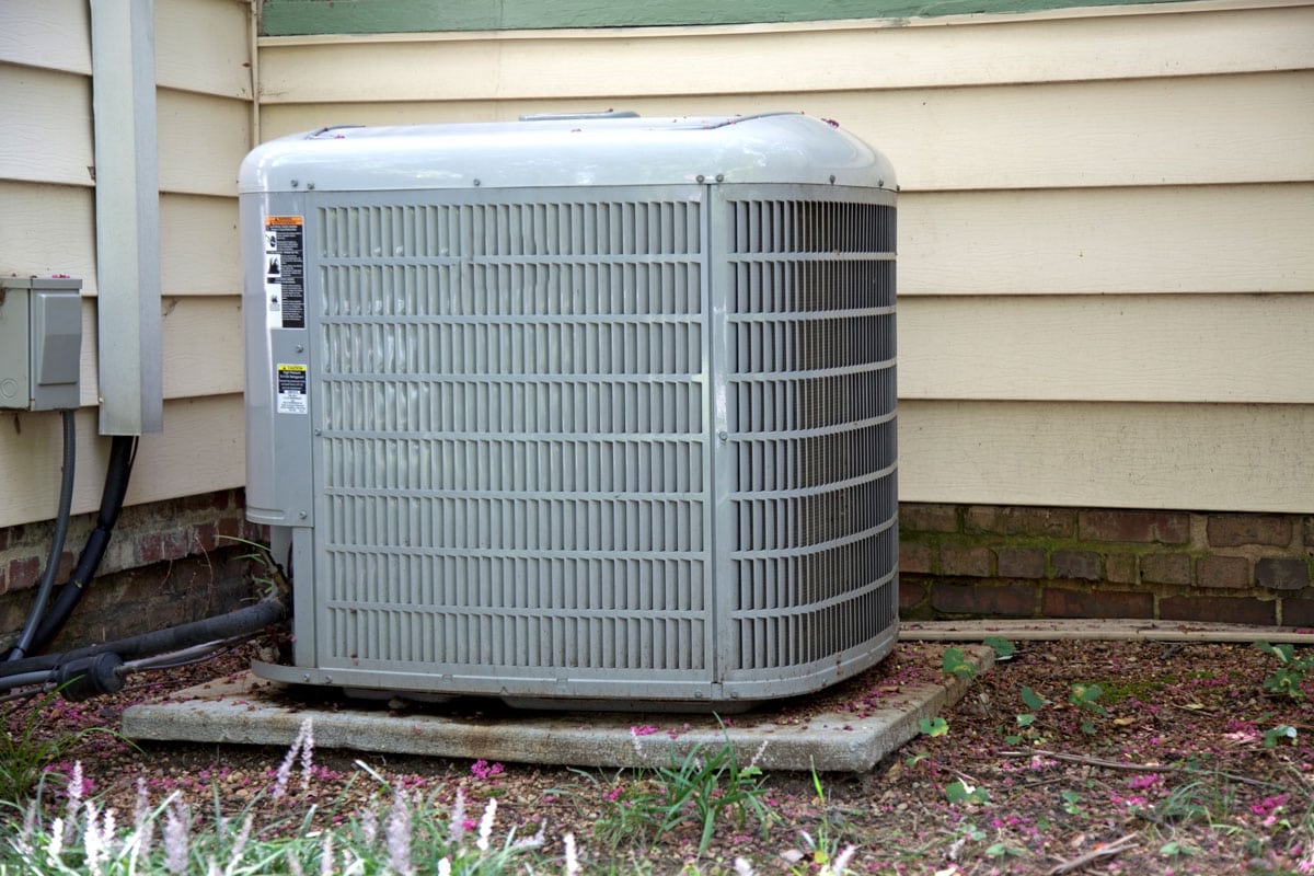 Air conditioner mounted on a concrete slab