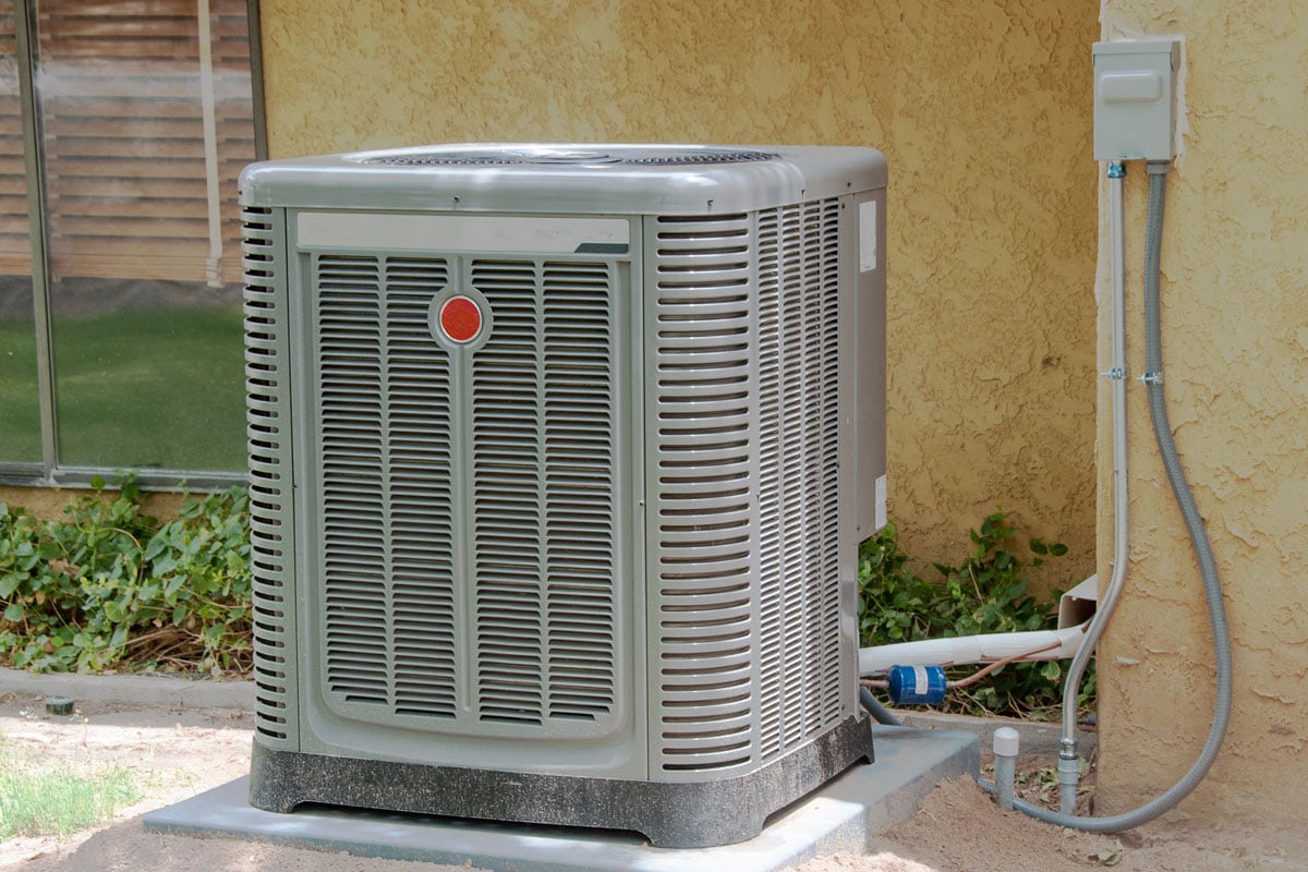 Air conditioner unit mounted on a concrete slab