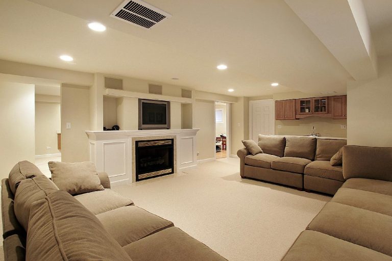 A basement in luxury home with couch and fireplace, Where To Put Heat Registers In Basement