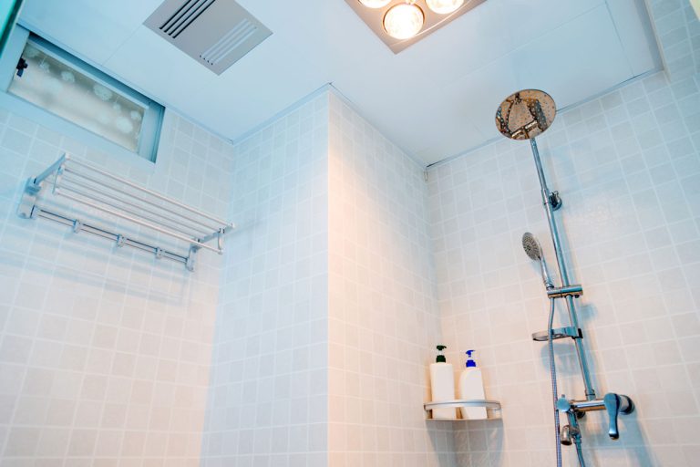 Bright spacious shower area with white ceiling and can recessed lighting, Should You Insulate Bathroom Ceiling?
