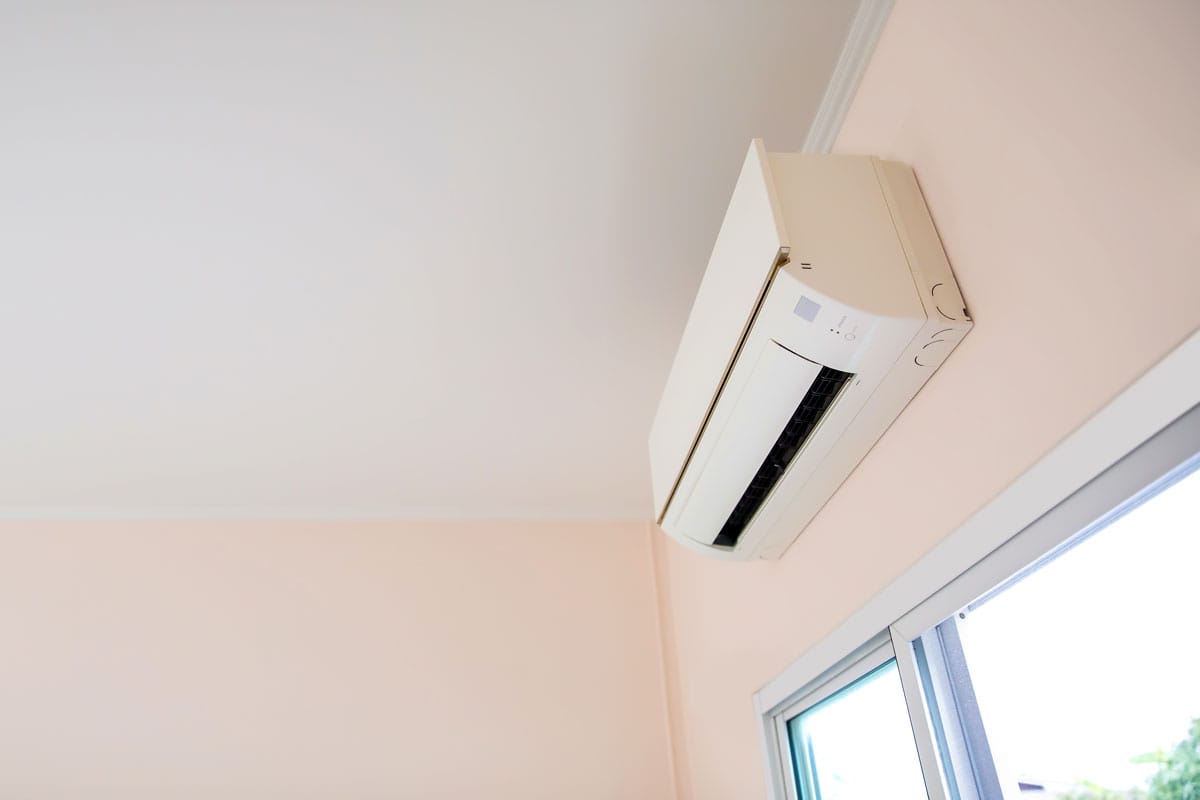 Close up air conditioner split type wall mounted in home room concepts of cool or heat or air cleaning filter and ser