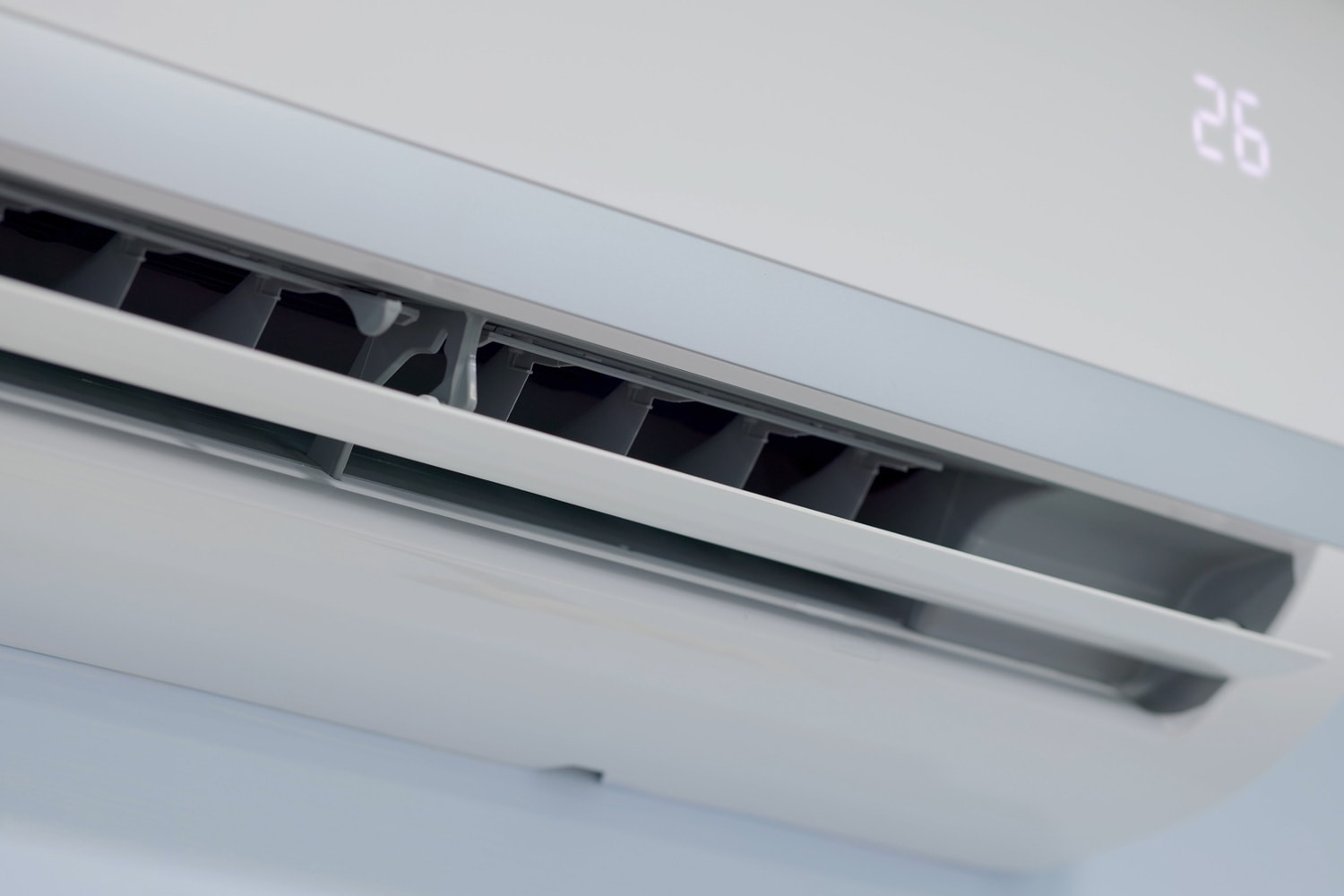 Energy Efficient concept - Close up shot of split type air conditioner on the wall