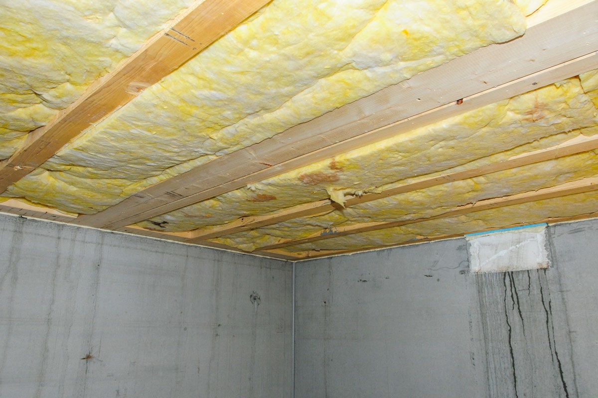 Fiberglass insulation installed on a basement roofing