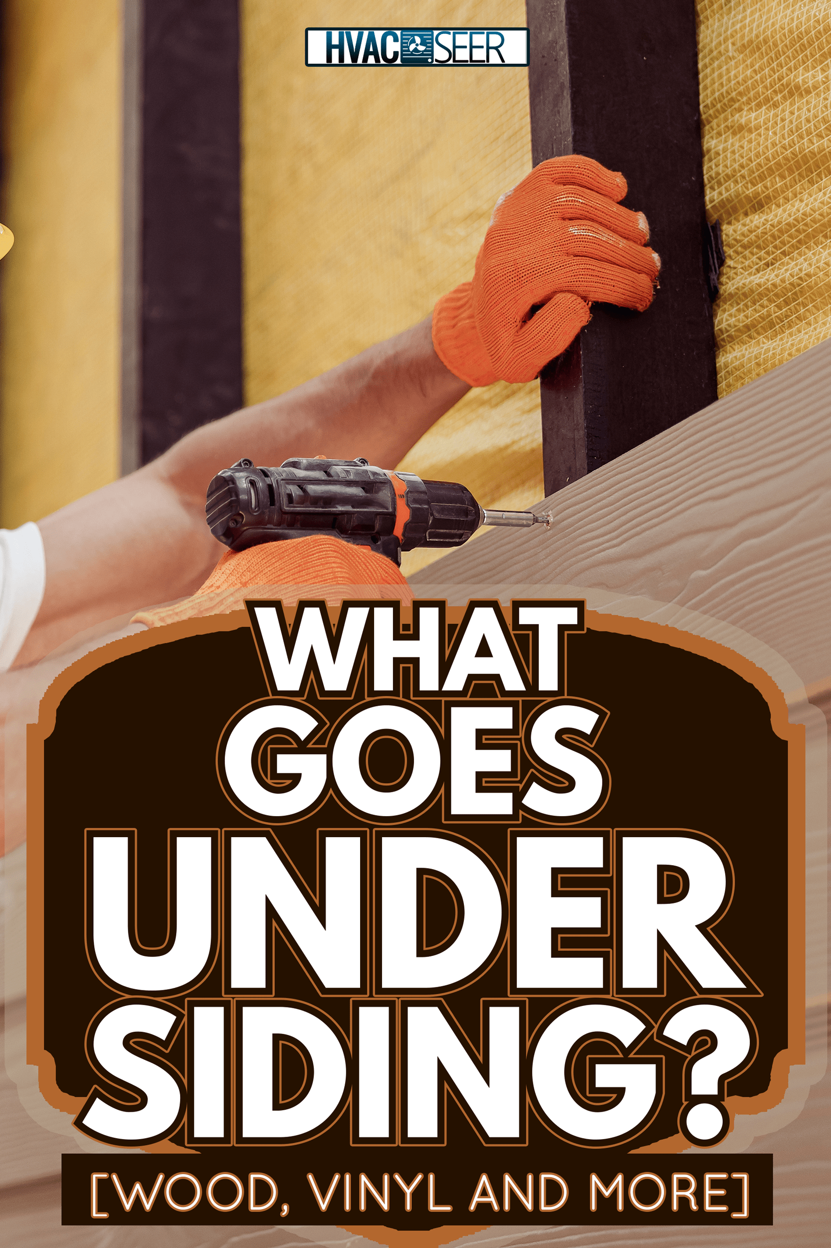 Handsome young man construction worker wearing safety helmet and work gloves while installing exterior wood siding - What Goes Under Siding [Wood, Vinyl And More]