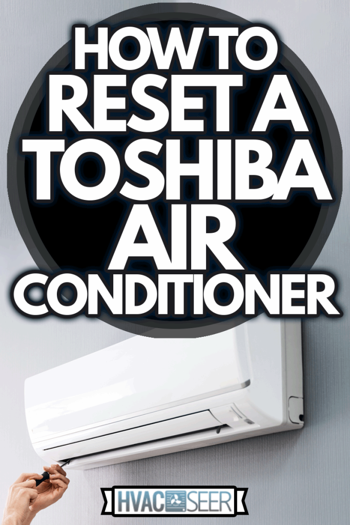 Happy Male Technician Repairing Air Conditioner With Screwdriver, How To Reset A Toshiba Air Conditioner