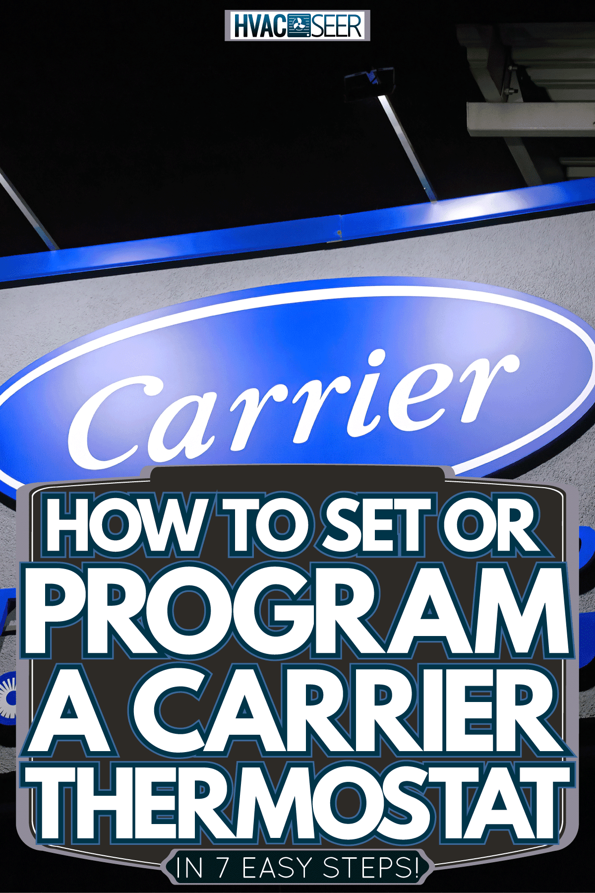 A huge Carrier logo outside a factory, How To Set Or Program A Carrier Thermostat [In 7 Easy Steps!]