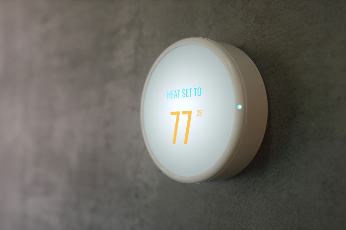 Learning Home Smart Thermostat On The Concrete Wall