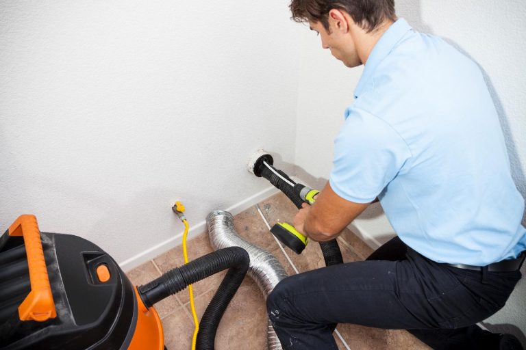 A man use vacuum cleaner to clean dryer vent, Water Leaking From Dryer Vent—What To Do?