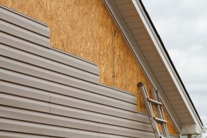 Read more about the article What Goes Under Siding? [Wood, Vinyl And More]