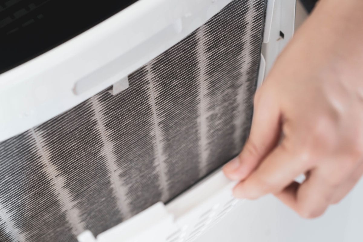 Removing the air filter of a portable air conditioner