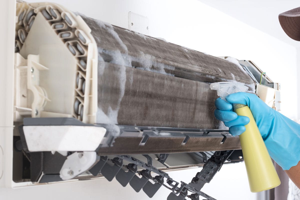 Spraying and washing the coil of the air conditioning unit
