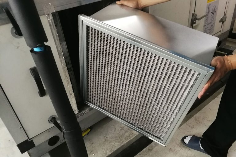 Technician checking a Medium -filter of air handling unit for replacement a new filter , Does MERV Rating Affect Airflow?