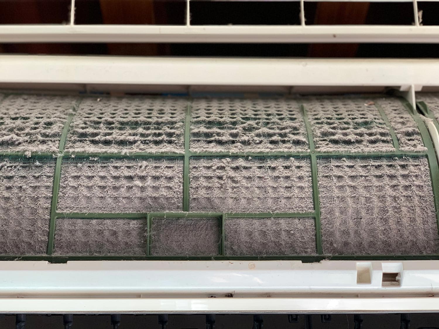 Very dirty air conditioner filter with a lot of dust