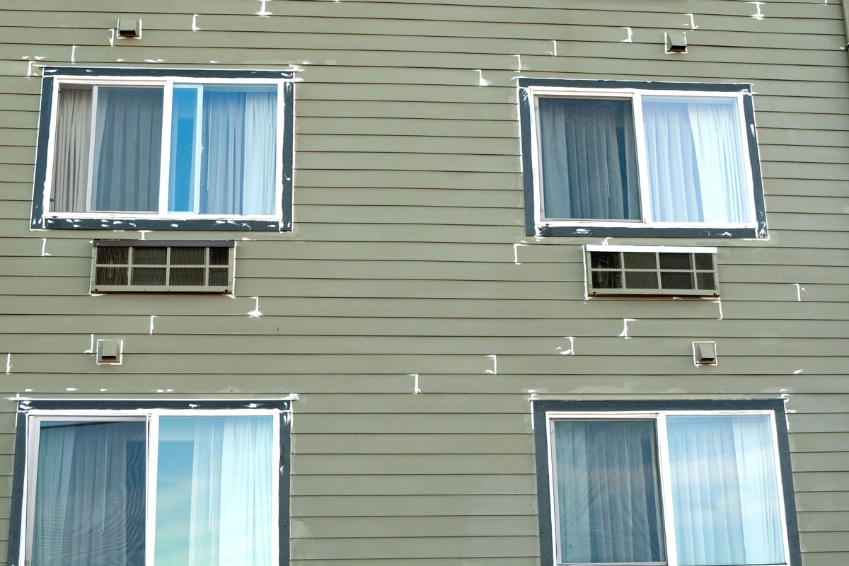 Weatherproofed windows of a two story apartment building