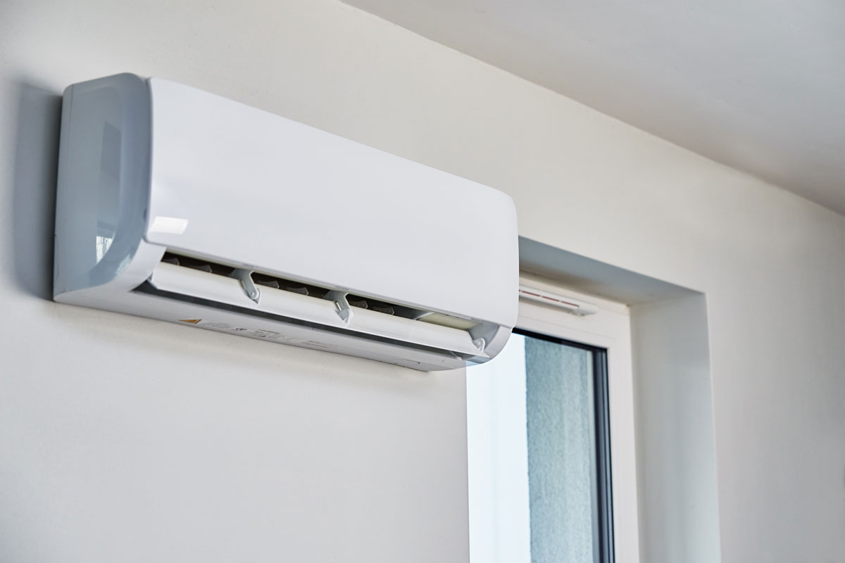White mini split air conditioning unit mounted on a wall