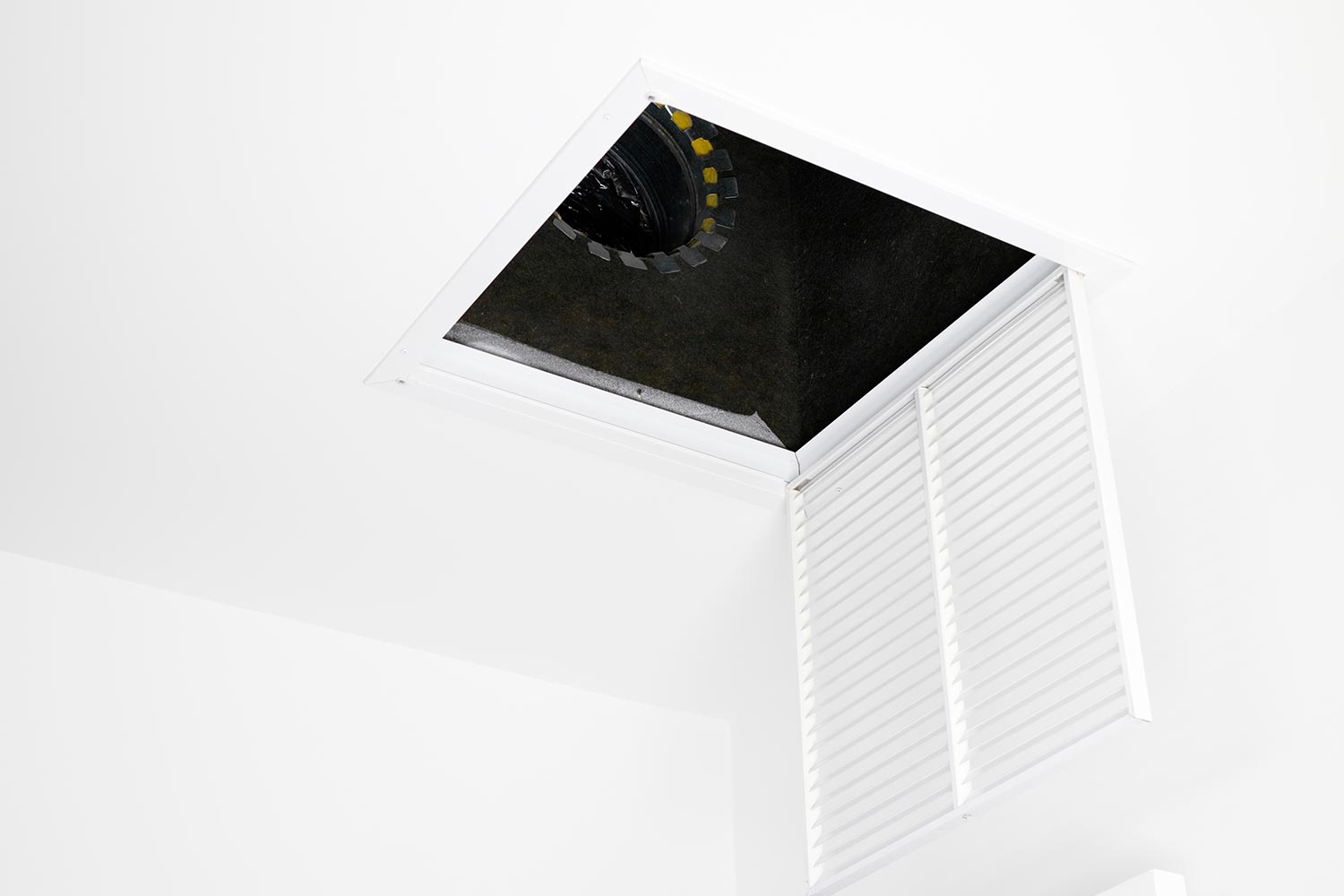 White square ceiling furnace air vent grate open