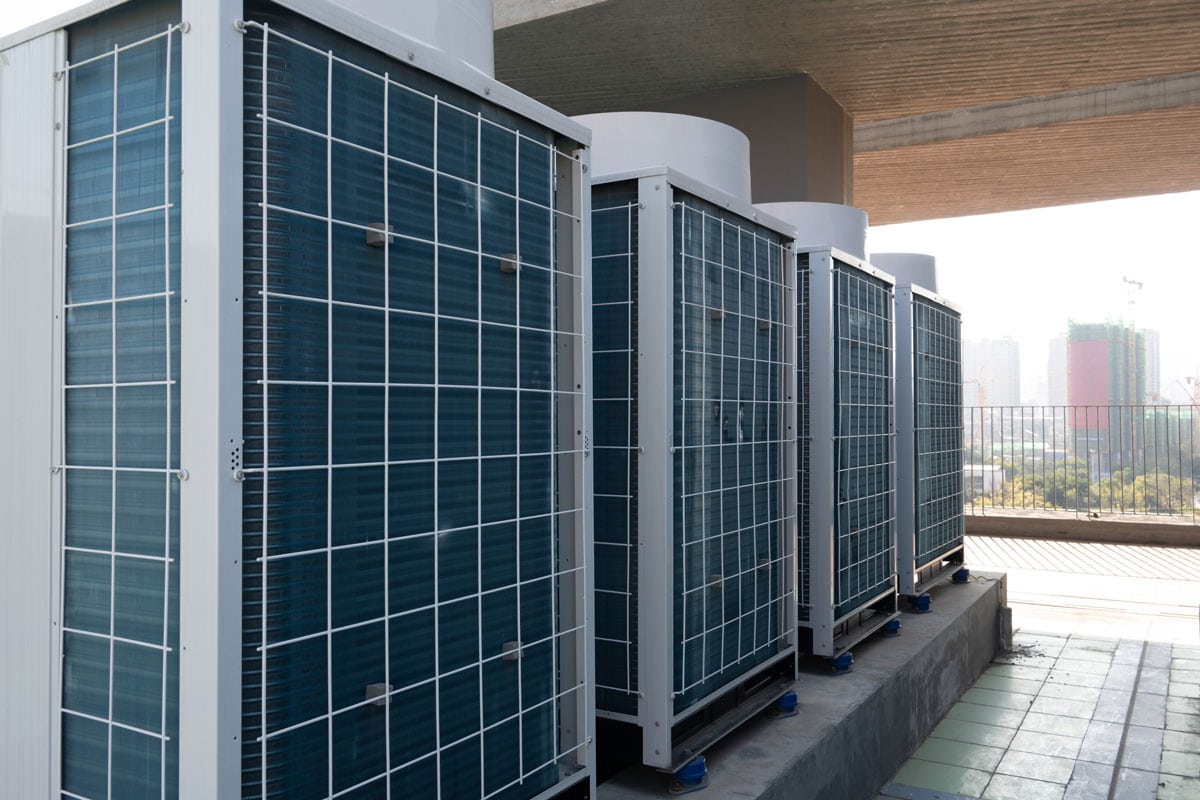 air conditioners and external condensers on the roof of the building