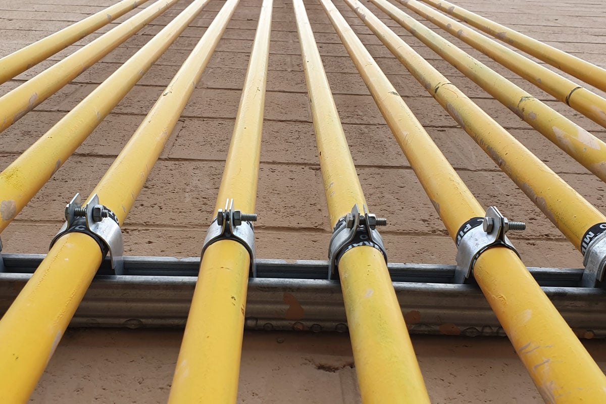 yellow gas pipes installed in a building