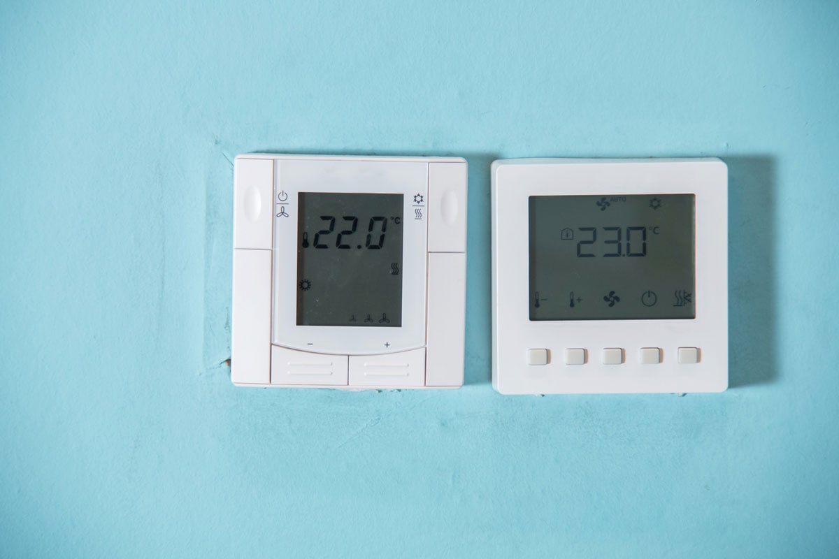 A Honeywell programmable thermostat to control the air conditioner and heater in a home