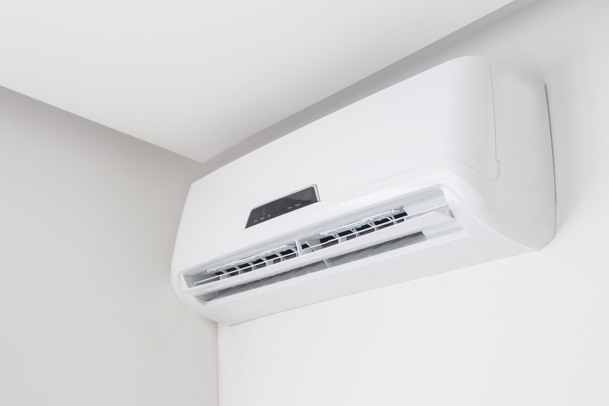 A mini split air conditioning inside a white living room