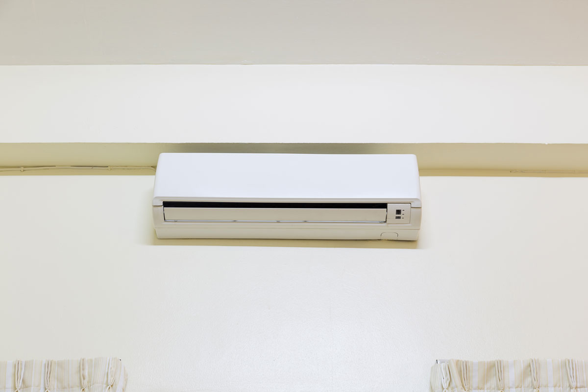 A mini split air conditioning unit mounted on a wall