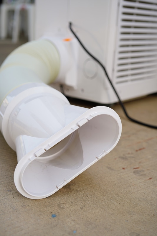 A vented portable air conditioning unit