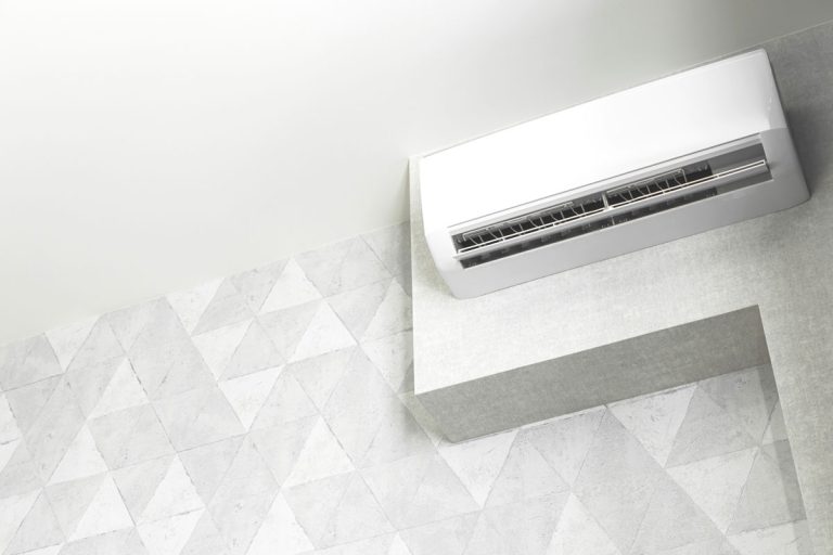 A white mini split air conditioning unit, How To Hide (Camouflage) A Mini Split Unit