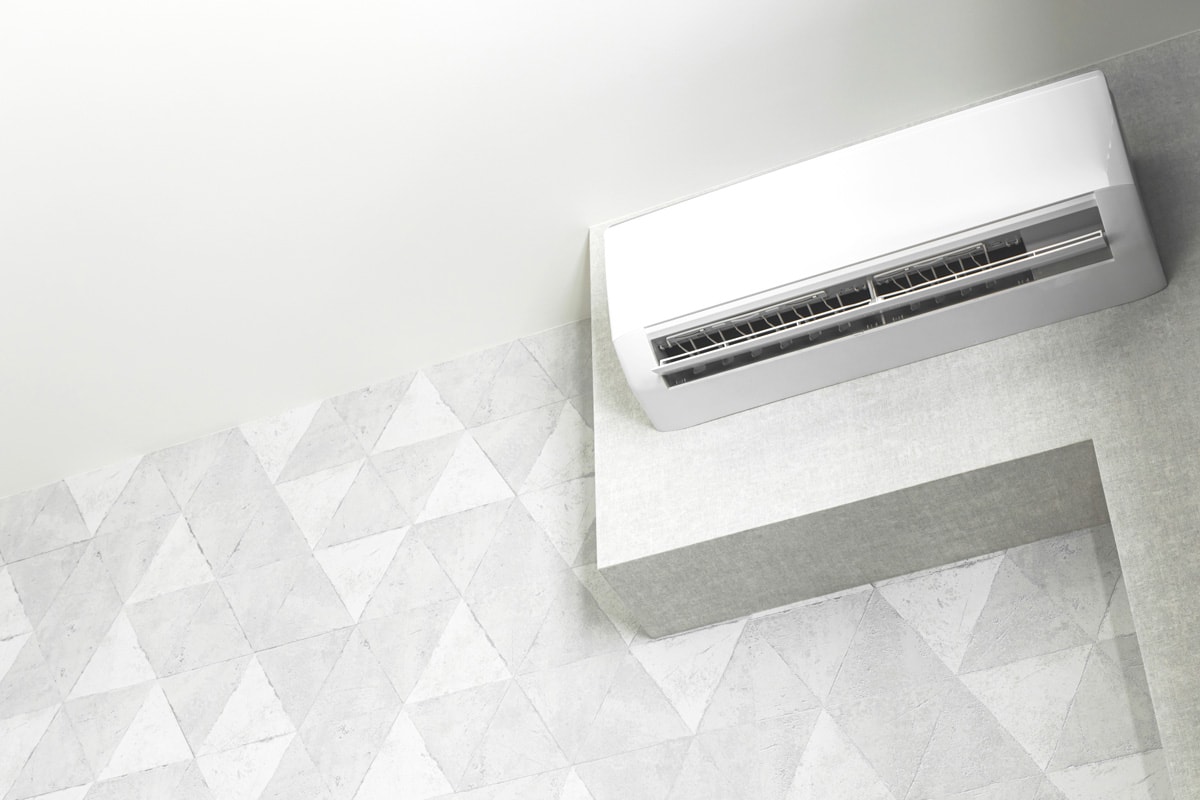 A white mini split air conditioning unit mounted on a wall