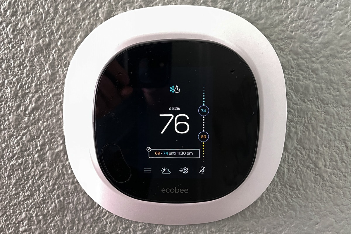 An Ecobee smart thermostat in a wall.