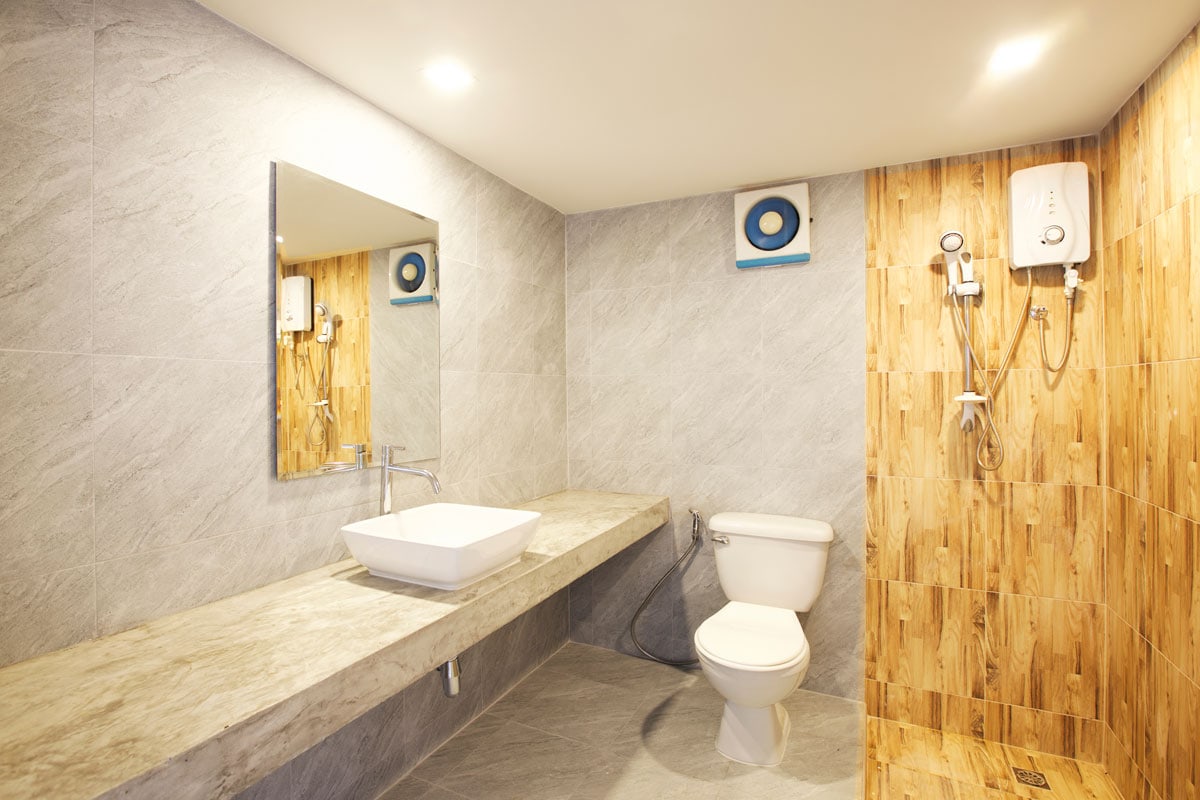 Bathroom Design by Interior Designers Bathroom with mirror, sink, water heater