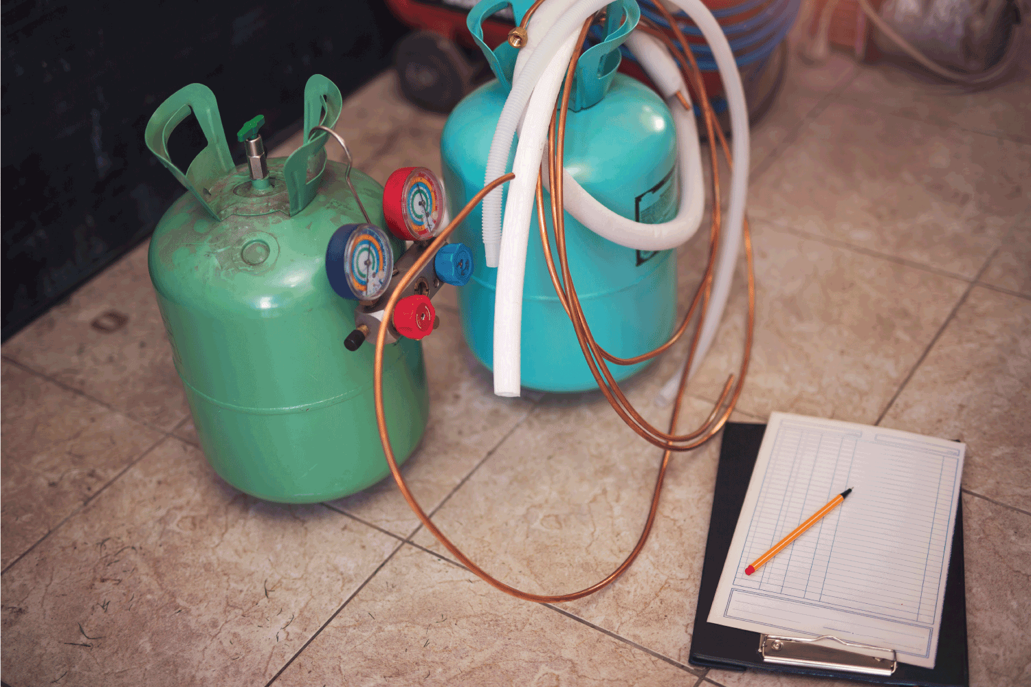 Freon gas cylinders with pressure meter. Workshop for replacement of freons in air conditioners