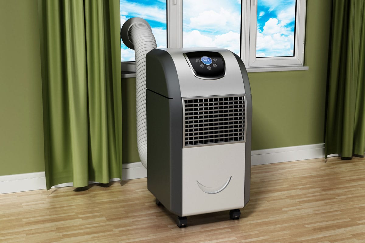 Generic portable air conditioner standing near the window in the room