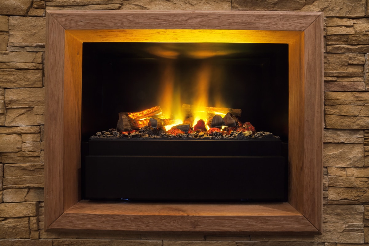Home interior decor, details of modern artificial fireplace.