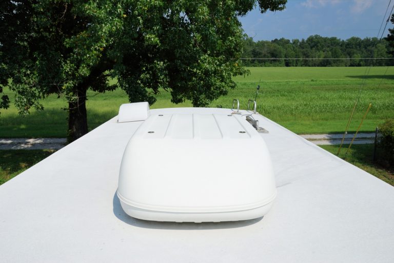 RV roof has large air conditioning unit, ladder, and roof vents - What Type Of Freon For A Coleman RV Air Conditioner