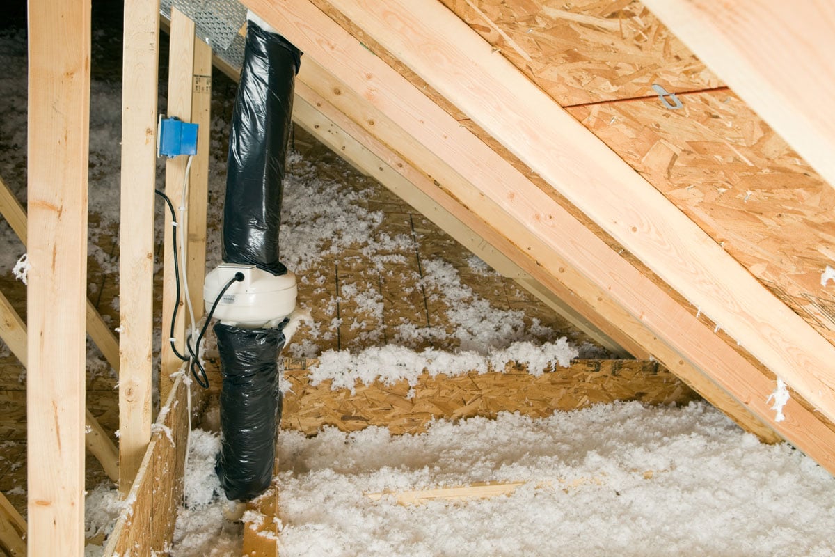 Radon mitigation vent pipe in the attic