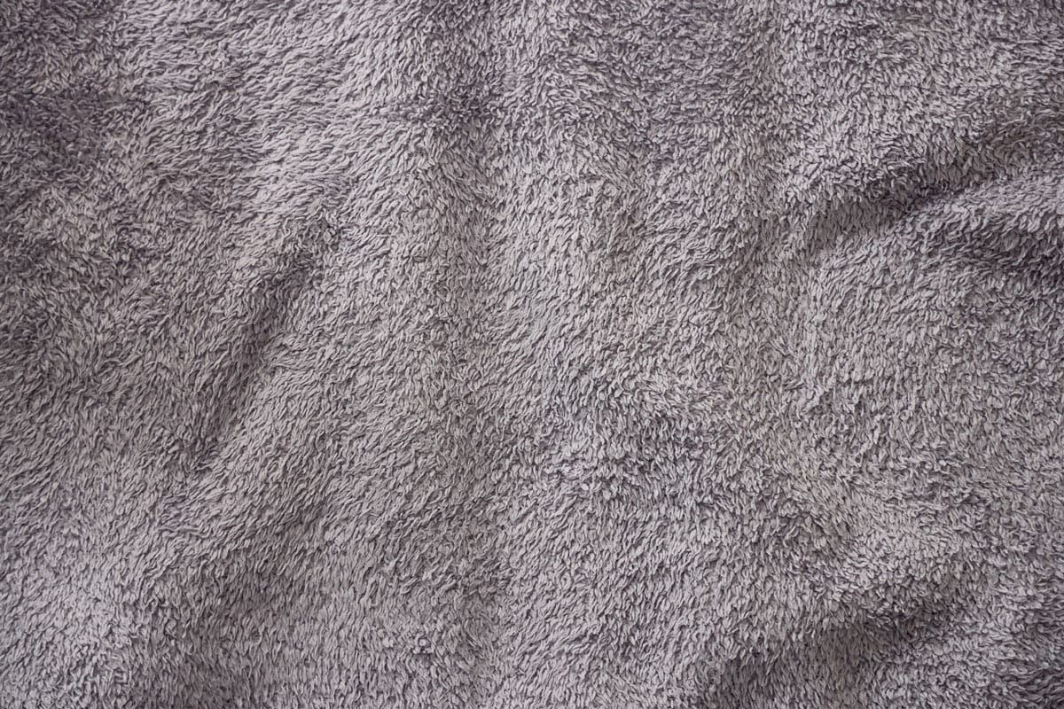 Texture of gray fleece, soft napped fabric
