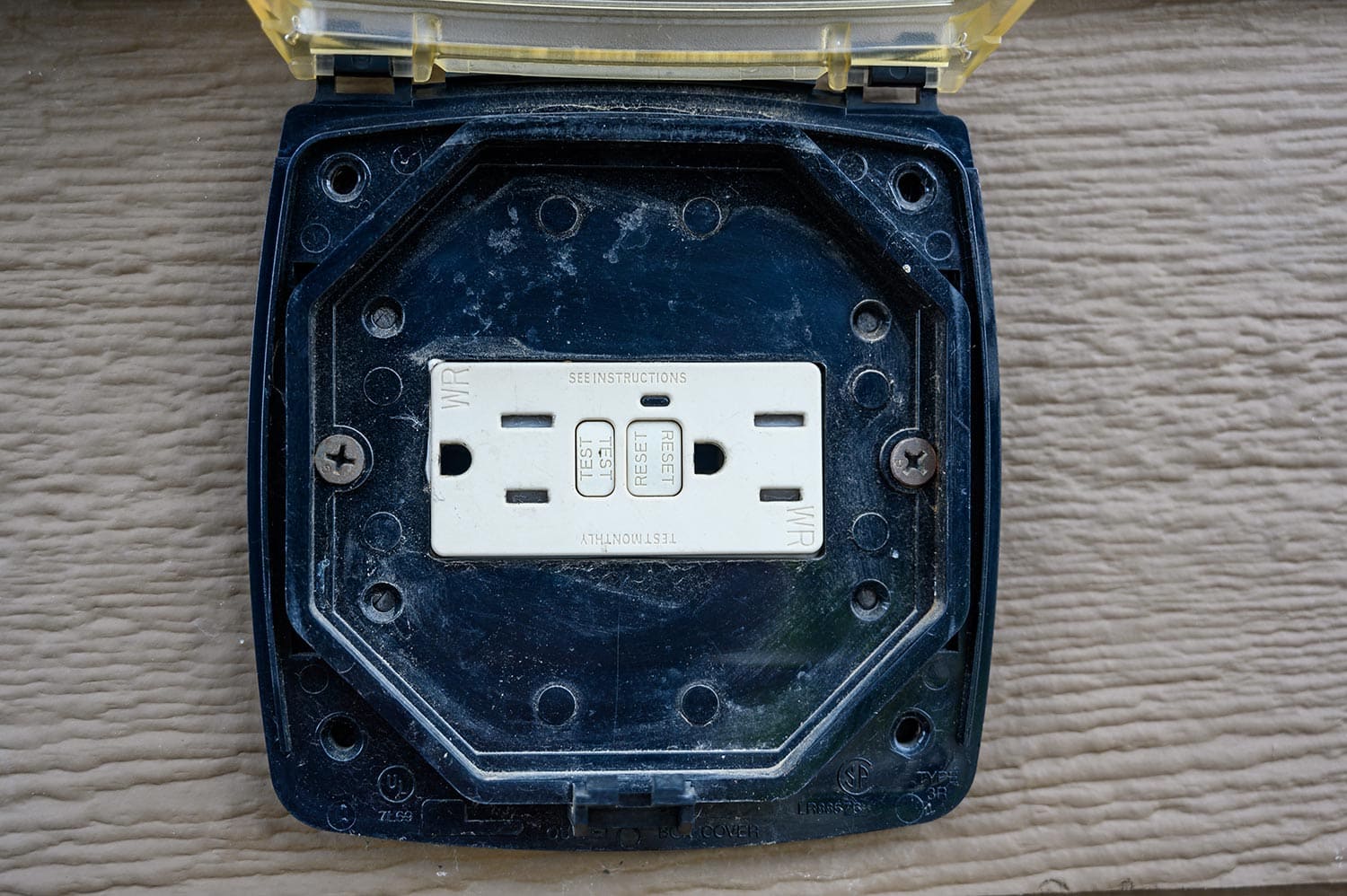 Tripped outdoor covered ground fault interrupter outlet