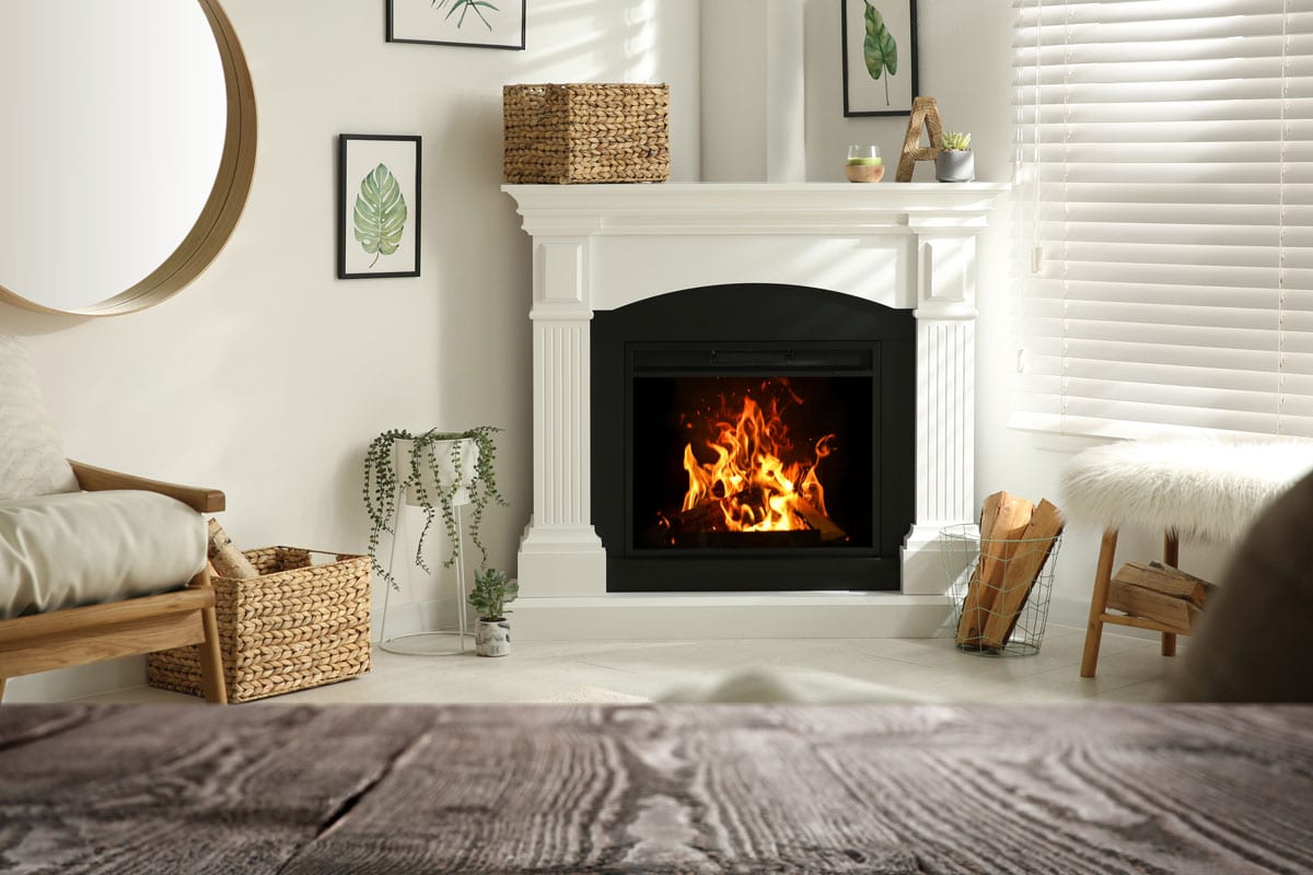 White mantel fireplace with wicker baskets and a gorgeous brown carpet