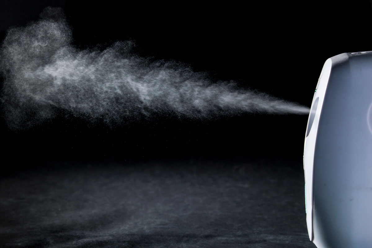air freshener spray in an isolated black background