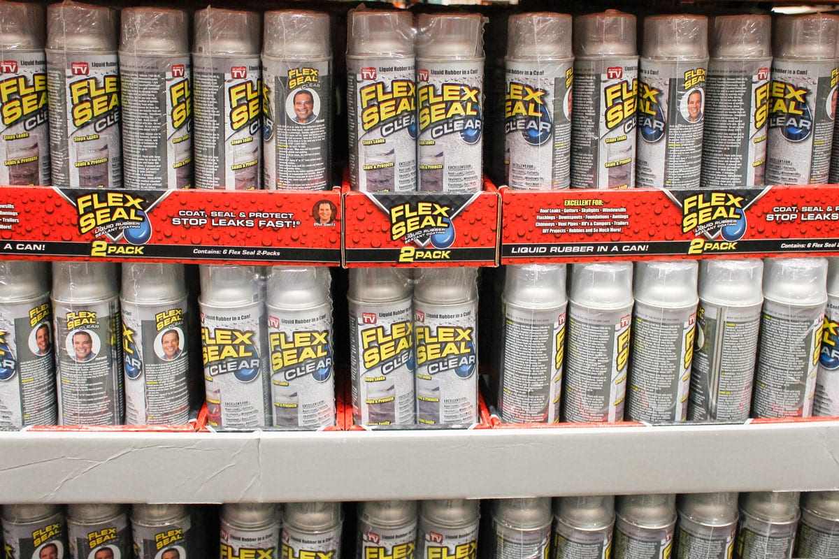 several cans of Flex Seal Clear, on display at a local big box grocery store