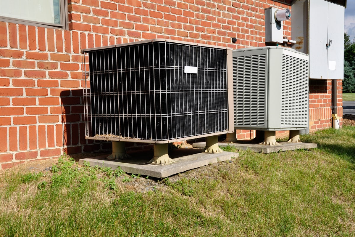 Air conditioning units mounted on concrete slabs