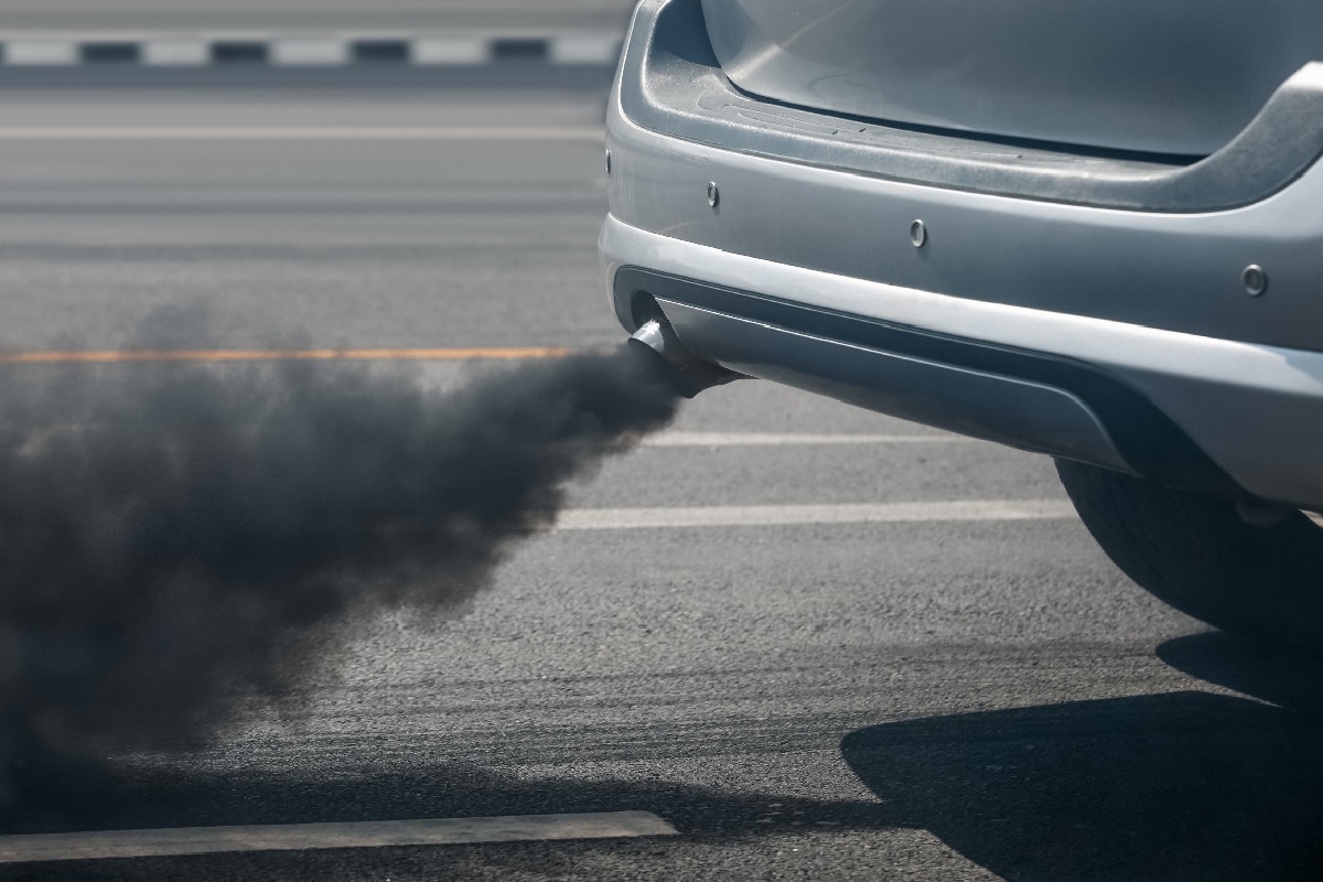Air pollution crisis in city from diesel vehicle exhaust pipe