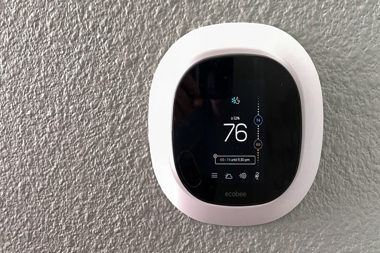 An Ecobee smart thermostat in a home, Ecobee Thermostat Stuck On Ecobee Screen - Why And What To Do