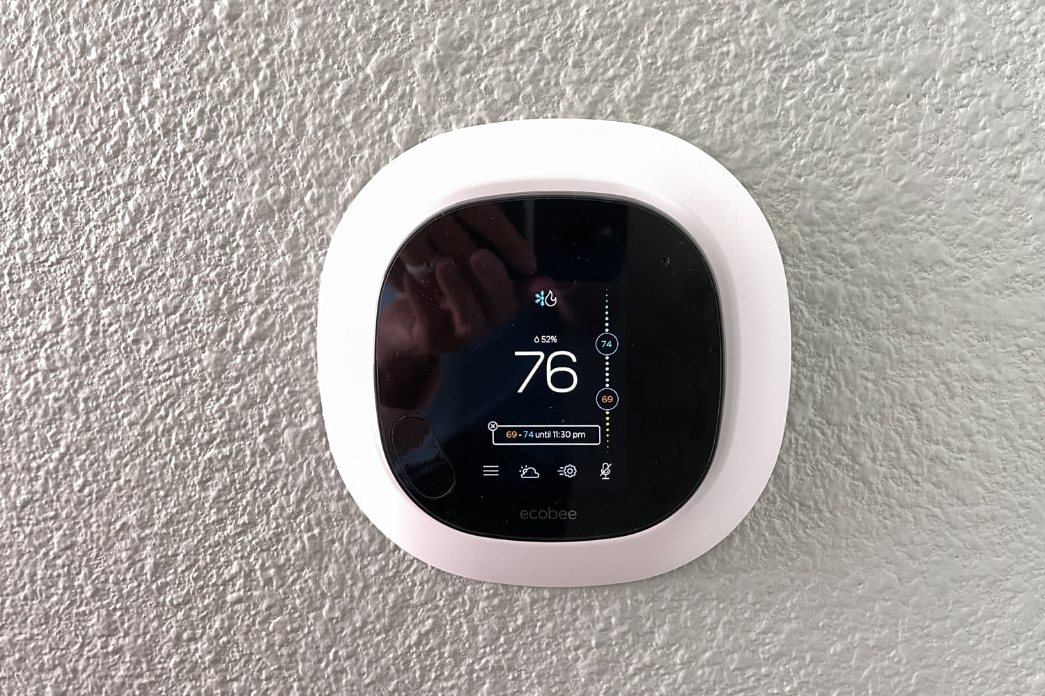 An Ecobee smart thermostat in a home. 