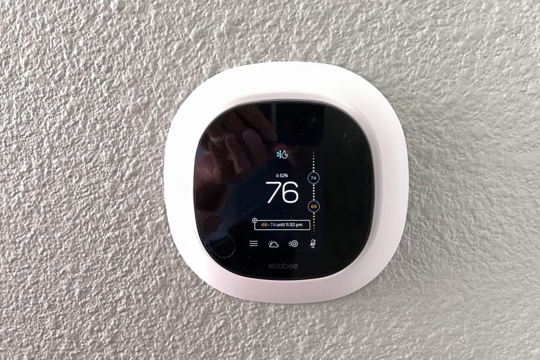 An Ecobee thermostat installed in a living room, Ecobee Thermostat Clicking Noise - What Could Be Wrong?