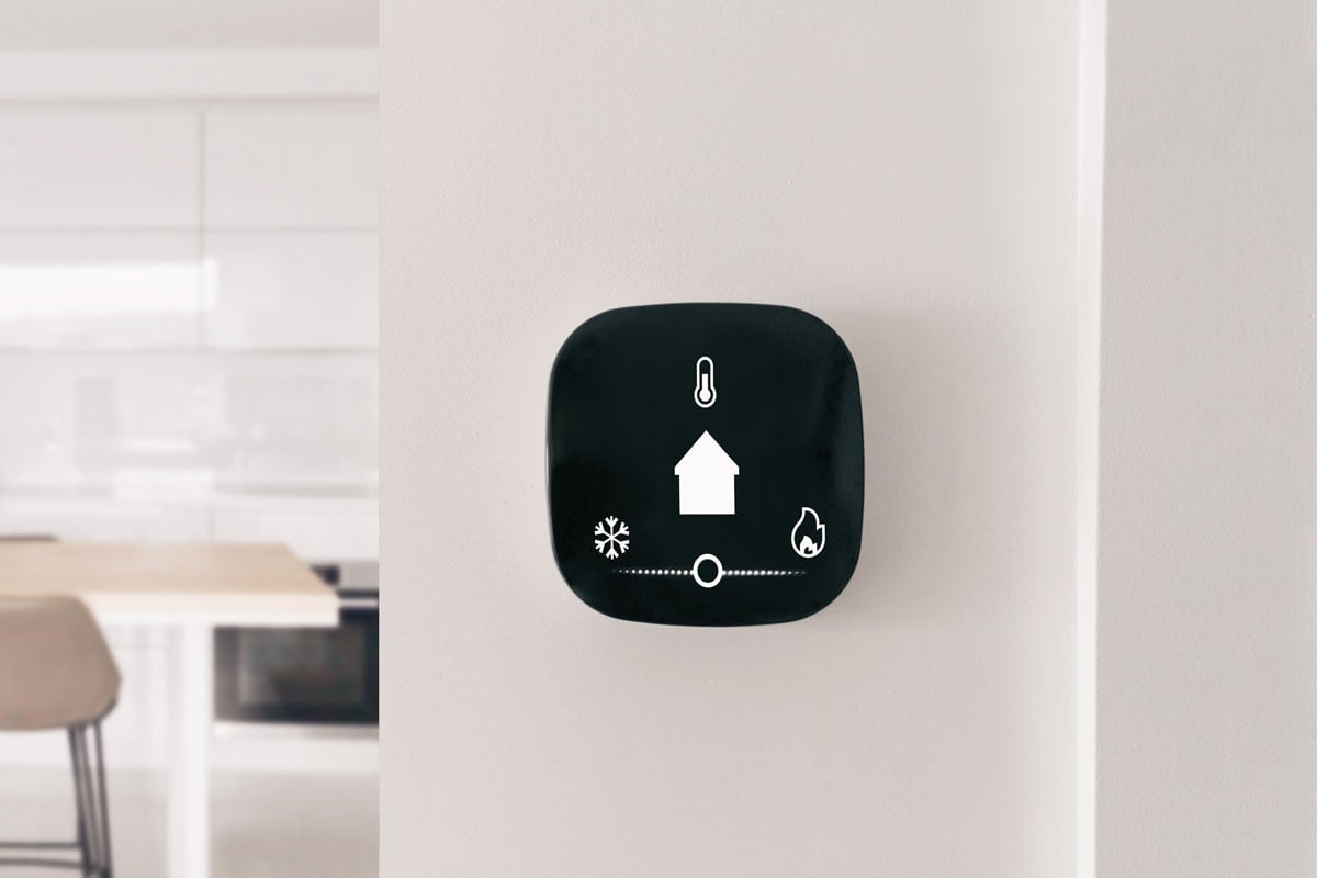 Connected thermostat with app icons showing temperature and heat cool adjustment