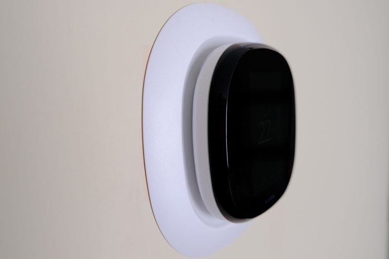 An ecobee style installed on the wall, Ecobee Thermostat Feels Warm - Is It Overheating?