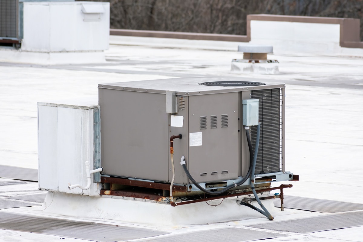 Horizontal shot of a commercial rooftop air conditioning unit.
