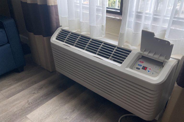 A hotel air conditioner installed near window, How To Reset GE Zoneline