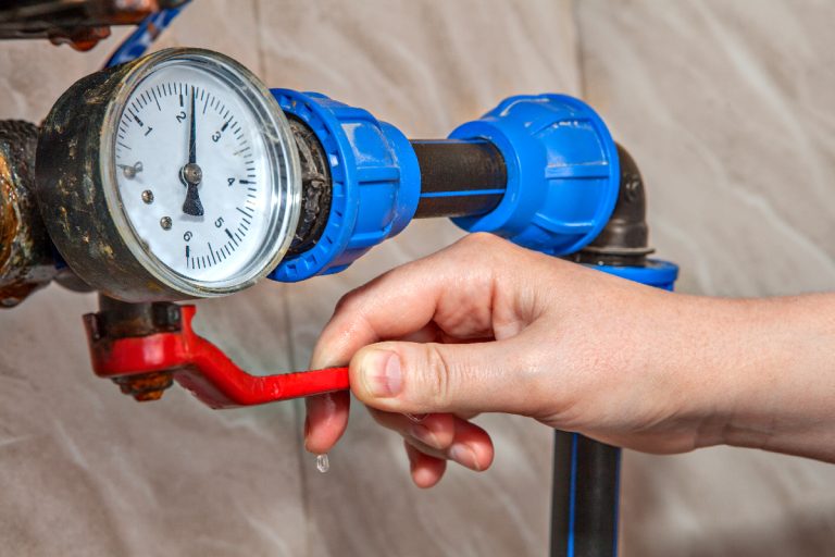 A man shuts off the main water shutoff valve, Does Shutting Off Water Affect AC Or Heater?